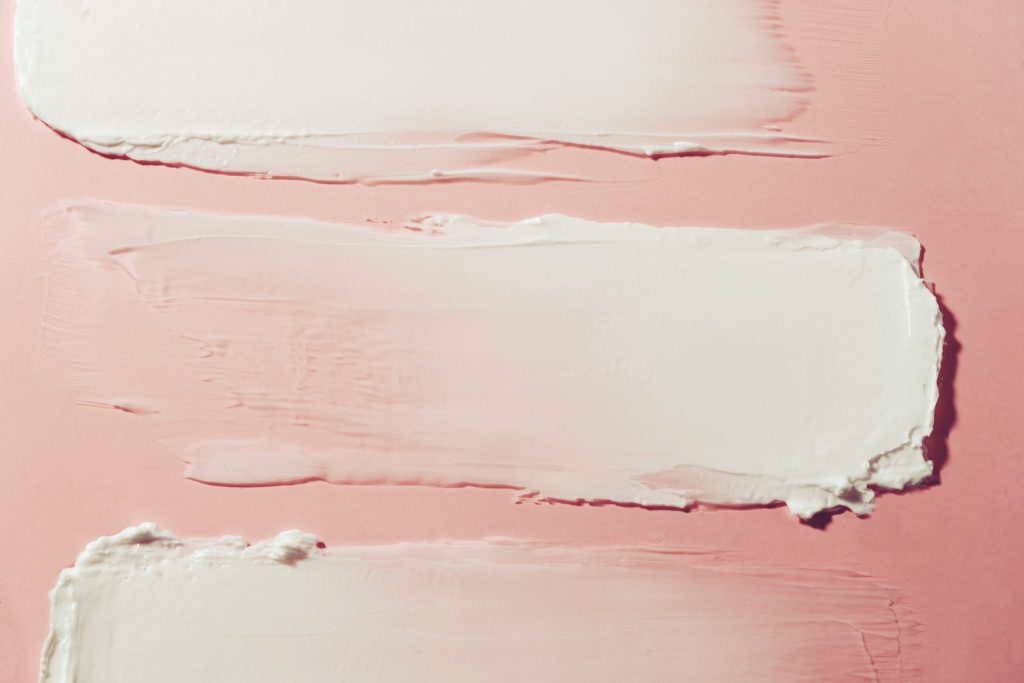 image,of,cream,smear.,pink,background