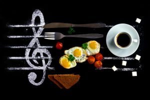 breakfast,concept,as,notes,in,music.,fried,eggs,with,tomatoes
