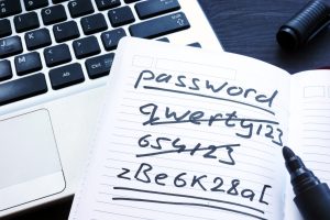 strong,and,weak,easy,password.,note,pad,and,laptop.