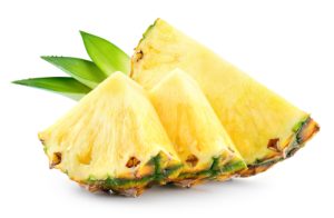 pineapple,slices,with,leaves.,pineapple,isolate.,cut,pineapple,on,white.